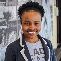 headshot of smiling Black woman student